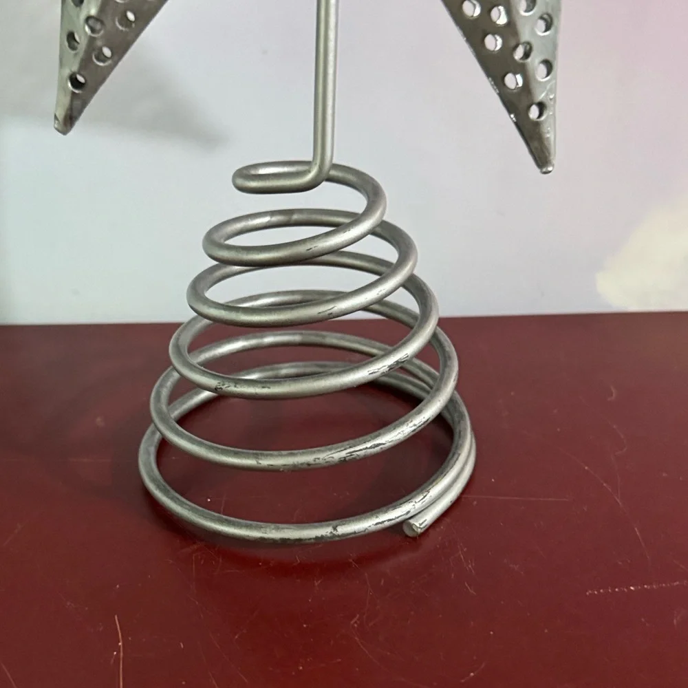 Silver Star Tree Topper Eight-point 3D star with intricate punch-work